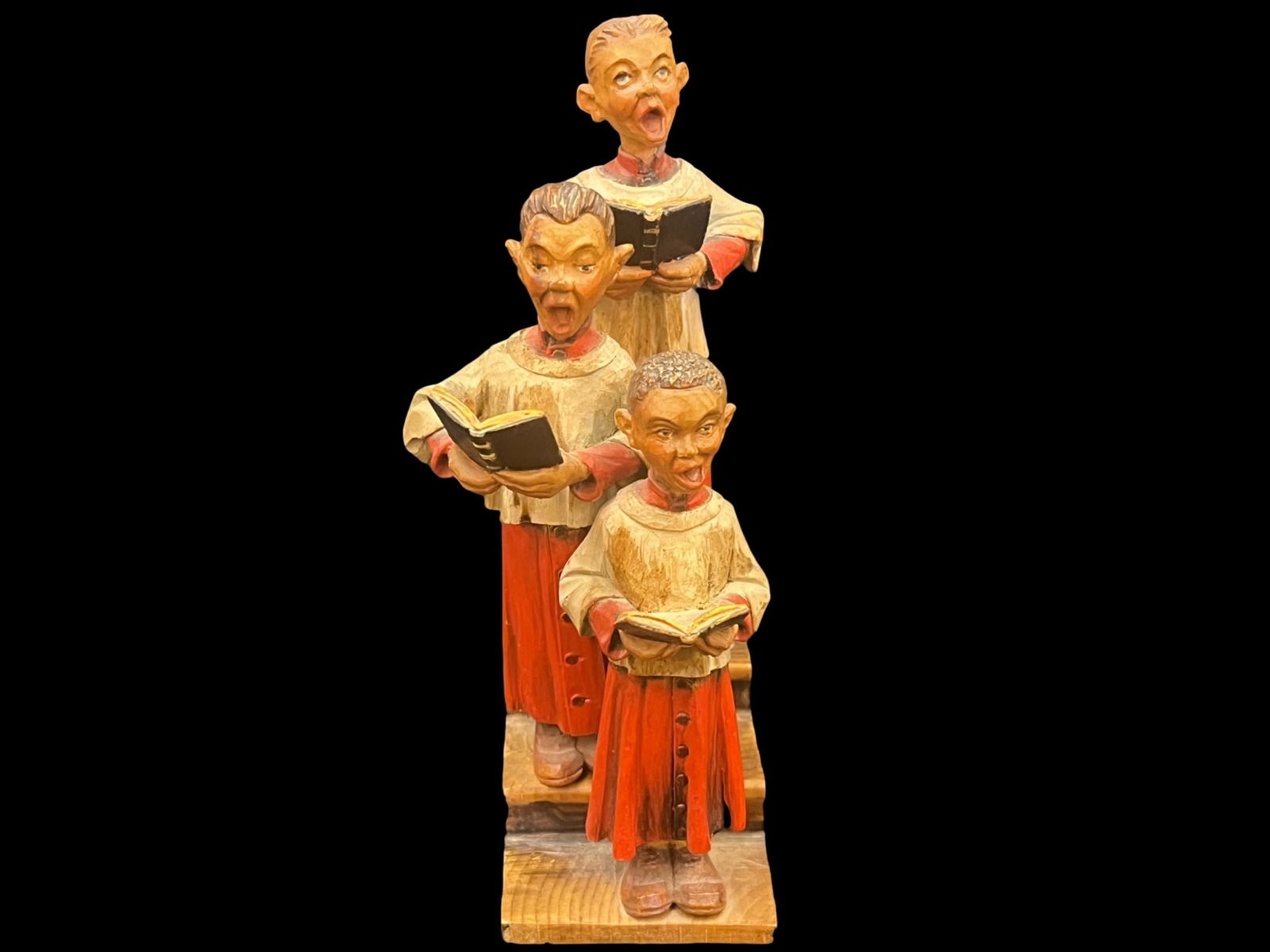Wooden Carving of Three mensinging in the Christmas choir. (1 of 10)