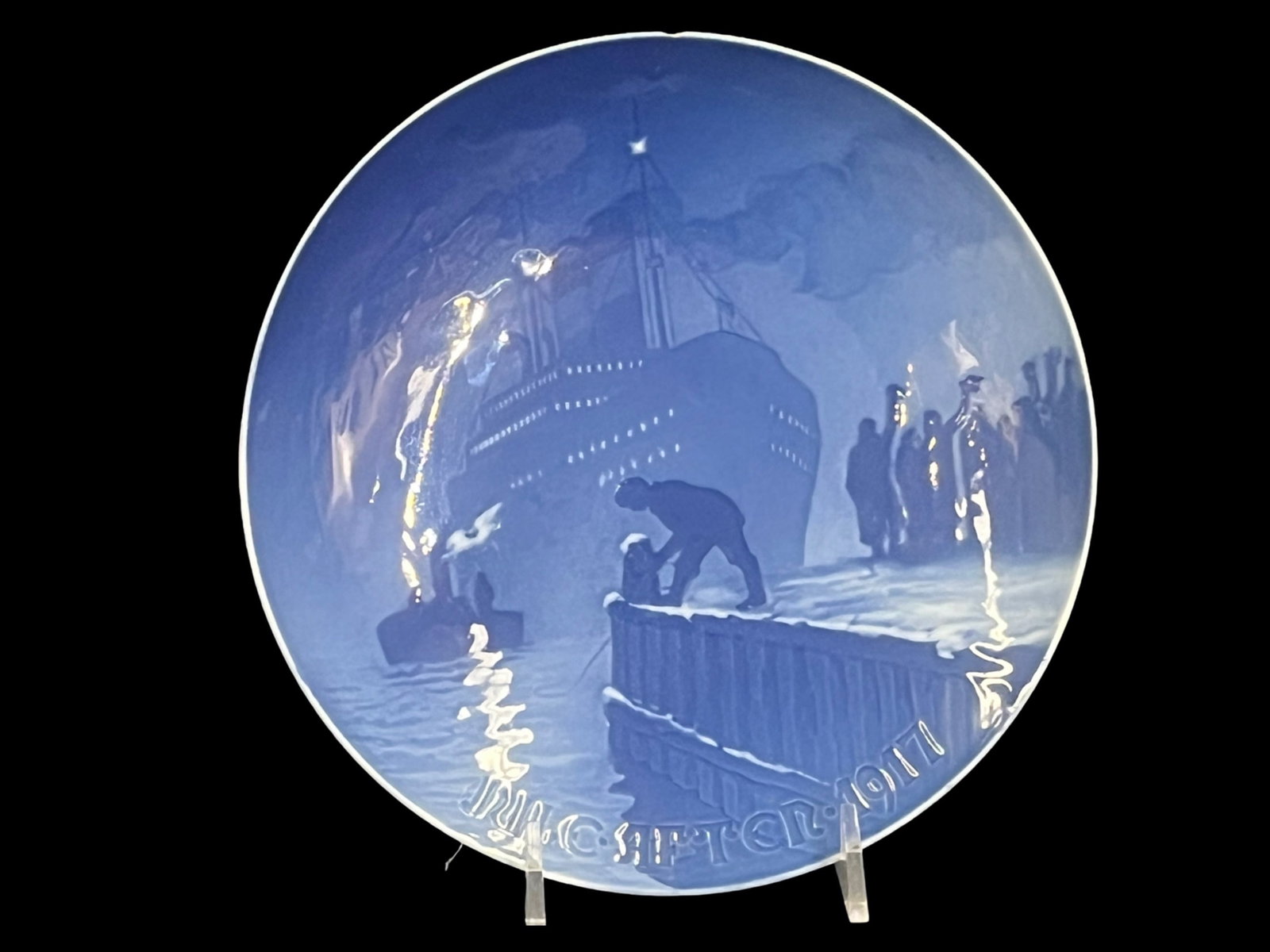 Bing & Grondahl, 1917, Arrival of the Christmas Boat Christmas Plate: Bing & Grondahl, 1917, Arrival of the Christmas Boat Christmas Plate B&G Year: 1917 Designer: Johannes Achton Friis Makers Markings On the Bottom 1917 Porcelain Plate Dimensions: 7” dia. (stand 