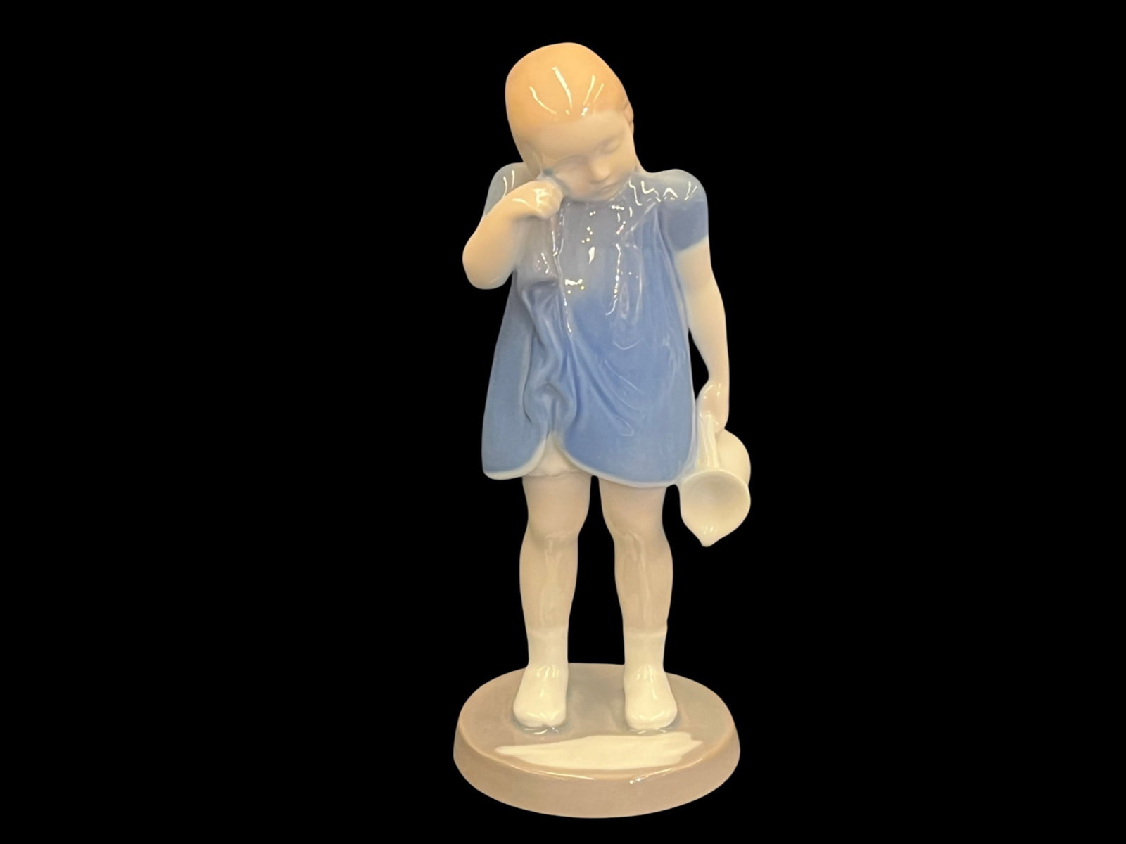 Bing & Grondahl Spilt Milk Figurine, 2246: Bing & Grondahl Spilt Milk Figurine Style: Spilt Milk, #2246 Porcelain Figure depicts girl standing with spilt milk Made in Denmark Markings: Stamped and Numbered on Bottom Dimensions: 7”T x 2.7