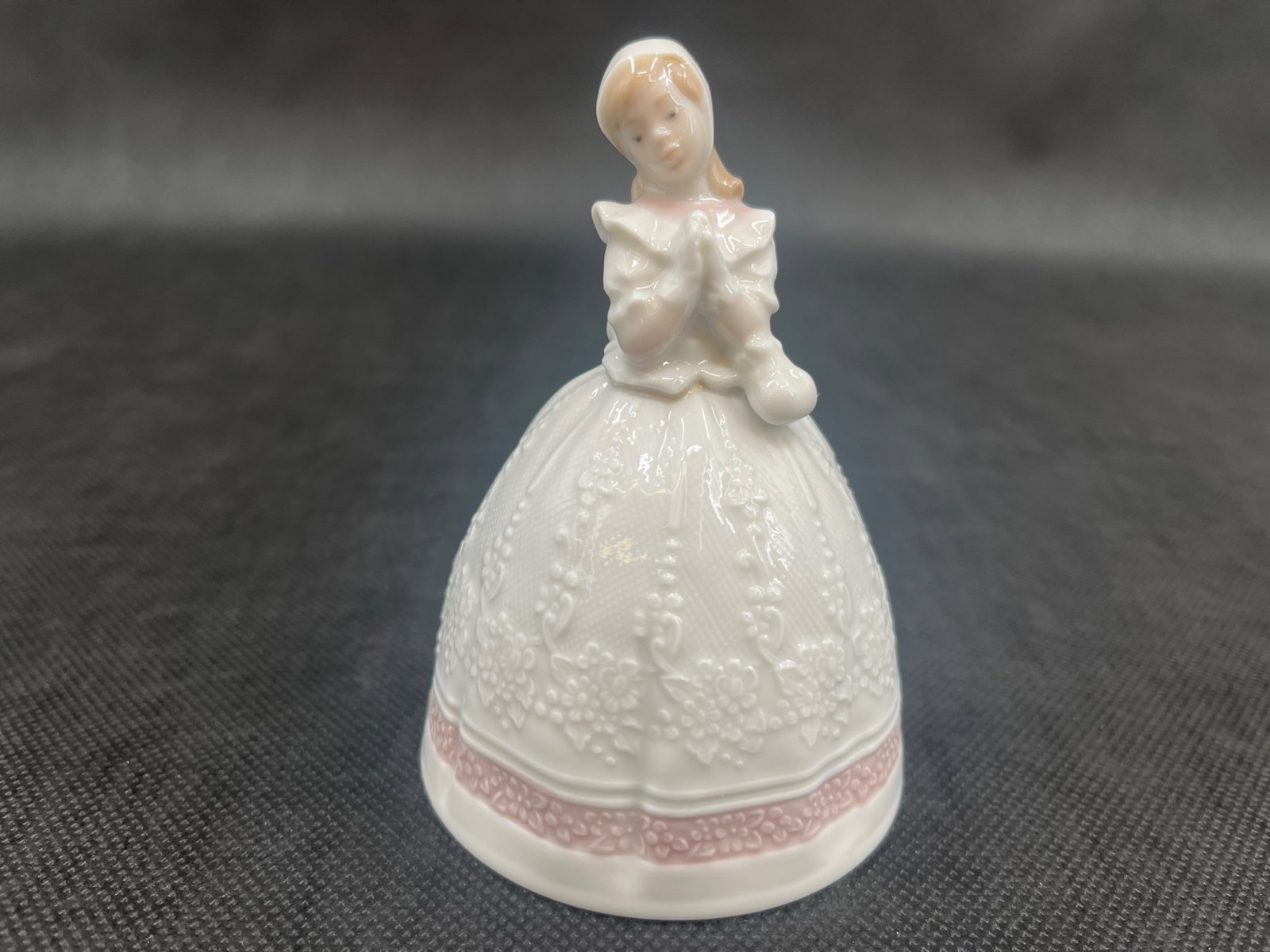 Lladro Porcelain Communion Bells QTY: Two: Two Lladro Porcelain Communion Bells #06176 Made in Spain Dimensions: 4.5”H x 3.25”W With Original Boxes