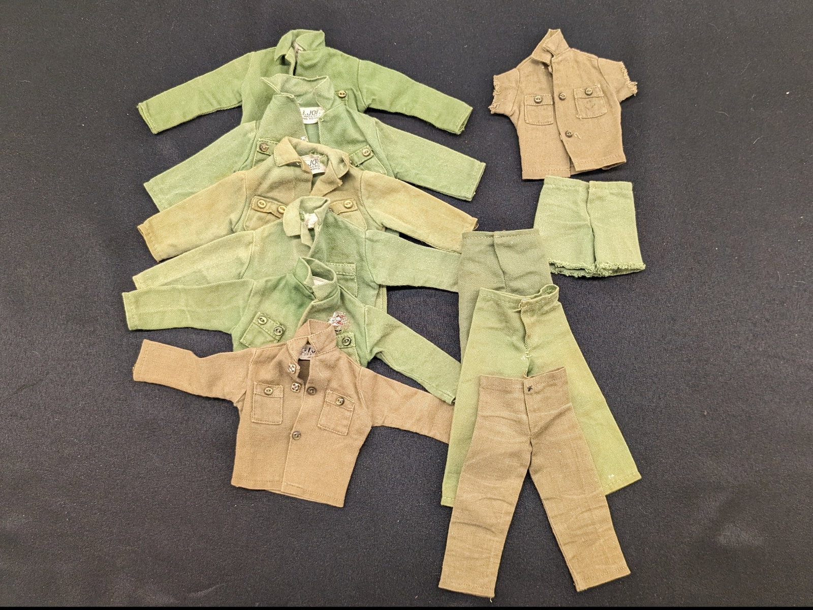 Vintage GI Joe 12" Action Figure Army Soldier Clothing Accessories: Vintage GI Joe 12" Action Figure Army Soldier Accessories Clothing. The lot includes the following: 6 Fatigue Green Shirts -5 tagged GI Joe by Hasbro Hong Kong -1 tagged GI Joe by Hasbro Japan 1 Fatig