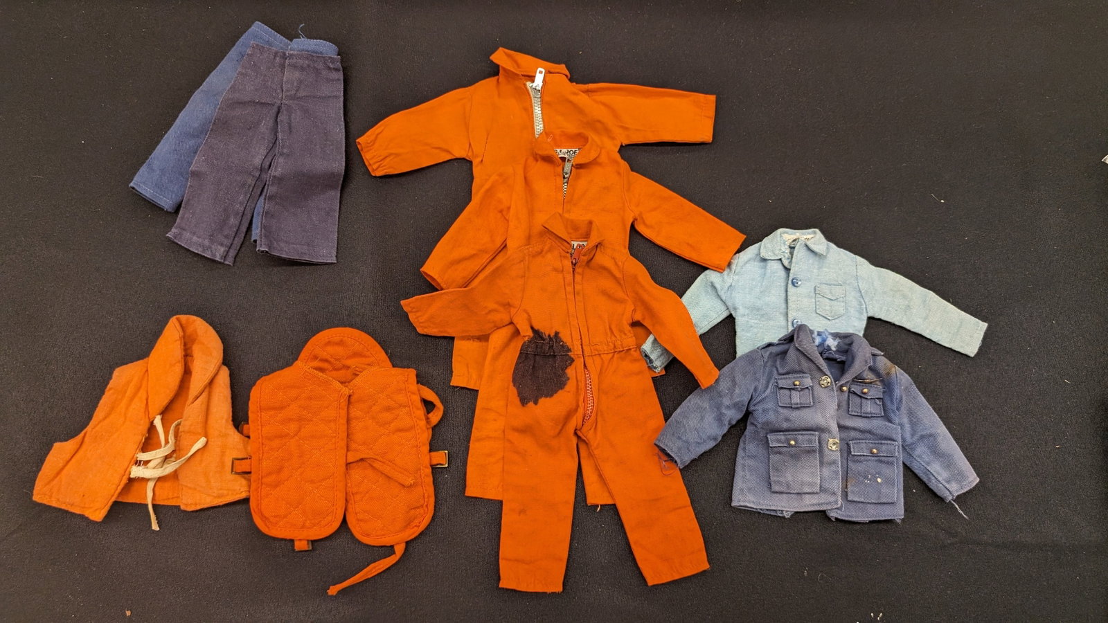 Vintage GI Joe 12" Sailor Clothing Accessories: Vintage GI Joe 12-in sailor clothing accessories. This lot includes the following: 3 Orange Jumpsuits with zippers -2 tagged GI Joe by Hasbro Hong Kong (1 has dark stain) -1 untagged 1 light blue shir
