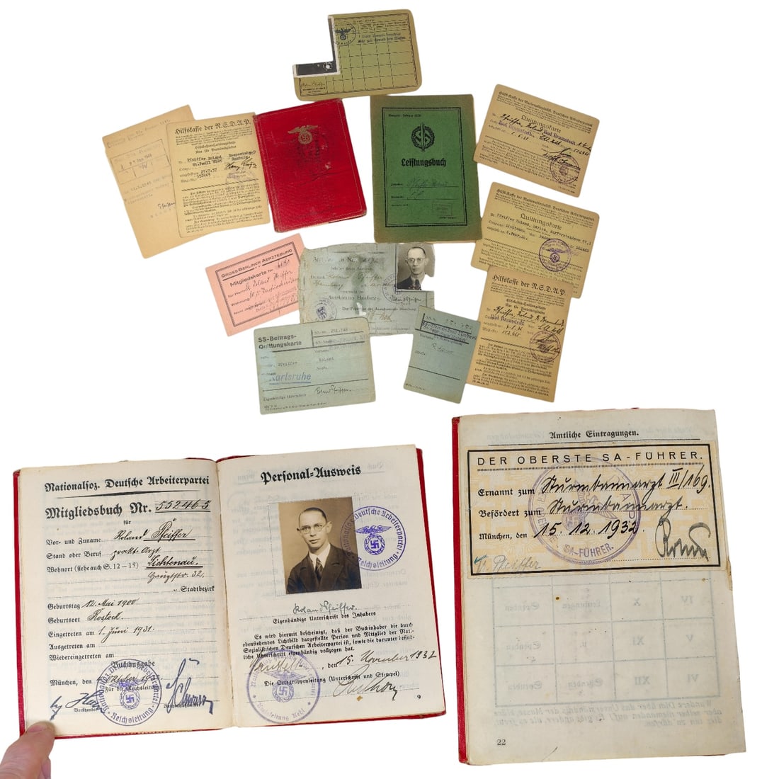 NSDAP Membership Book Grouping of Roland Pfeiffer with Ernst Rohm Signed Promotion: Early NSDAP Membership Book Grouping of Roland Pfeiffer with Ernst Rohm Hand Signed Promotion. The hand signed promotion slip is pasted to an official entry page Amtliche Eintragungen Dienstbuch. Thes