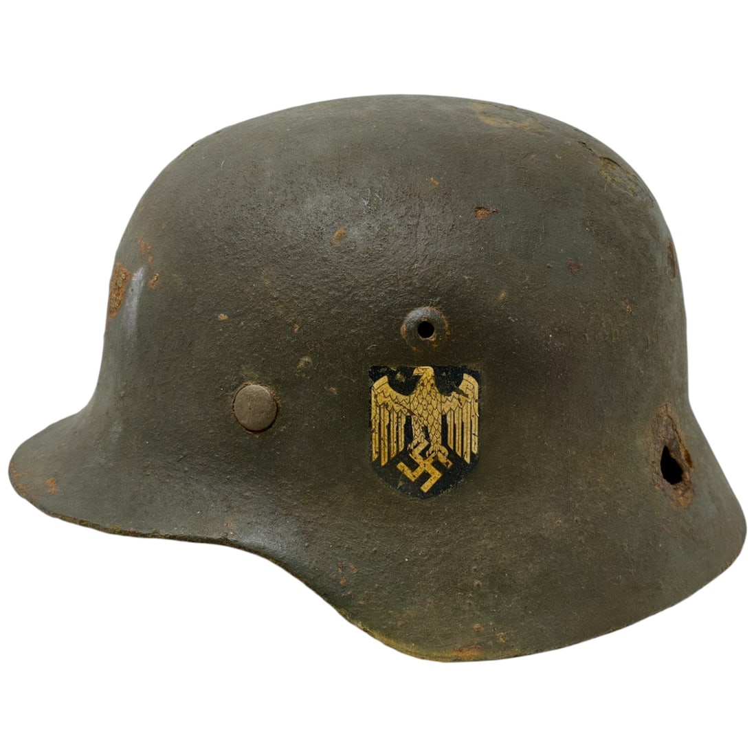 German WWII Wehrmacht Heer M35 Helmet from The Eastern Front: German WWII Wehrmacht Heer M35 Helmet from The Eastern Front, battle damaged.