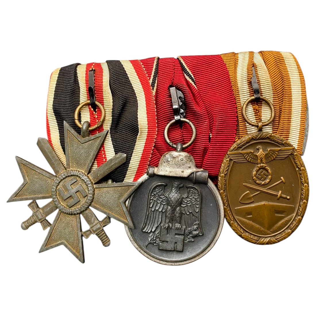 Third Reich 3 Place Medal Bar: Third Reich 3 Place Medal Bar with War Merit Cross, Eastern Front Medal, and Westwall Medal.