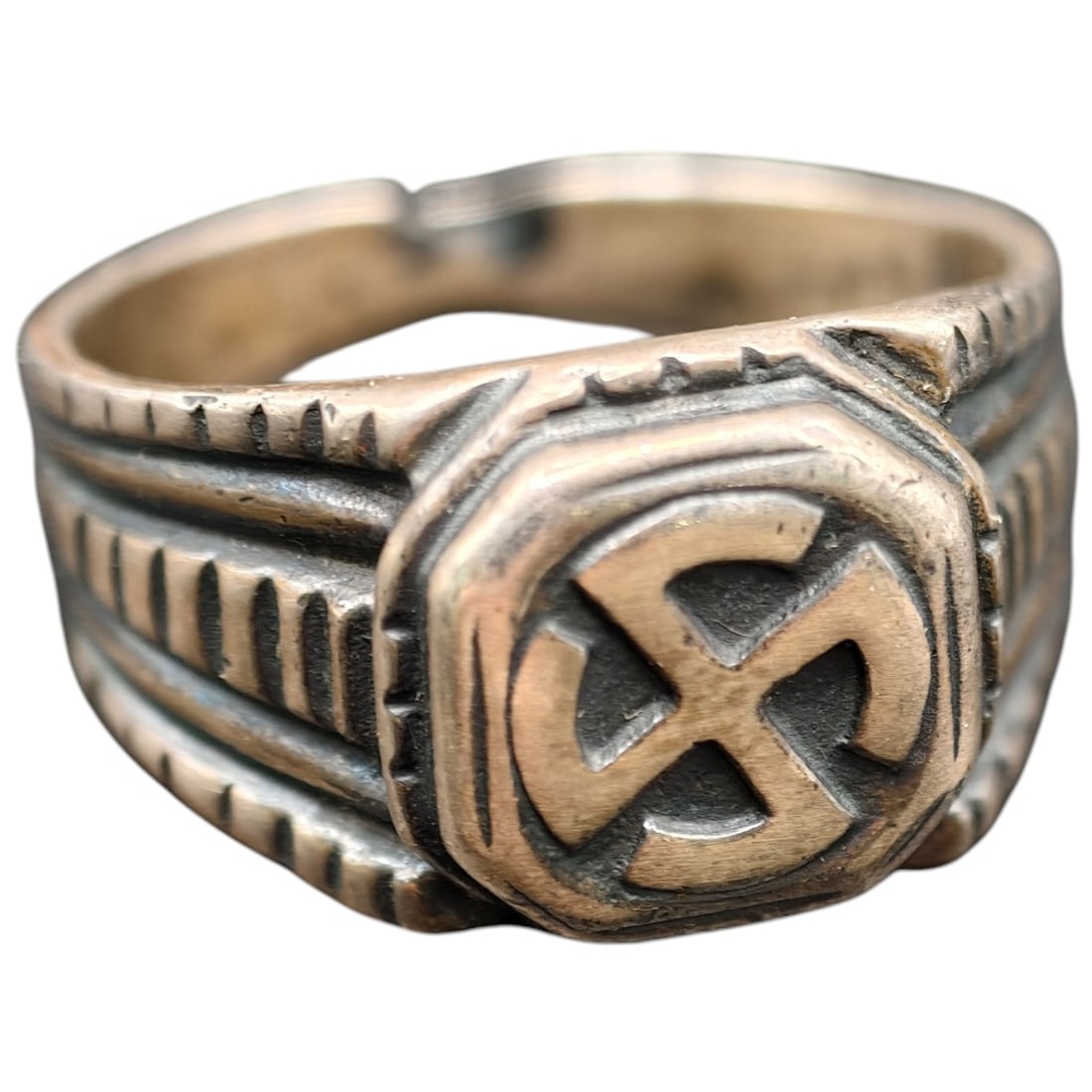 Third Reich NSDAP Nazi Sympathizer Ring 800 Silver: A ring in what appears to be silver-toned metal featuring a raised octagonal panel with a stylized swastika motif, flanked by ribbed shoulder decoration. No visible hallmarks or maker's marks are