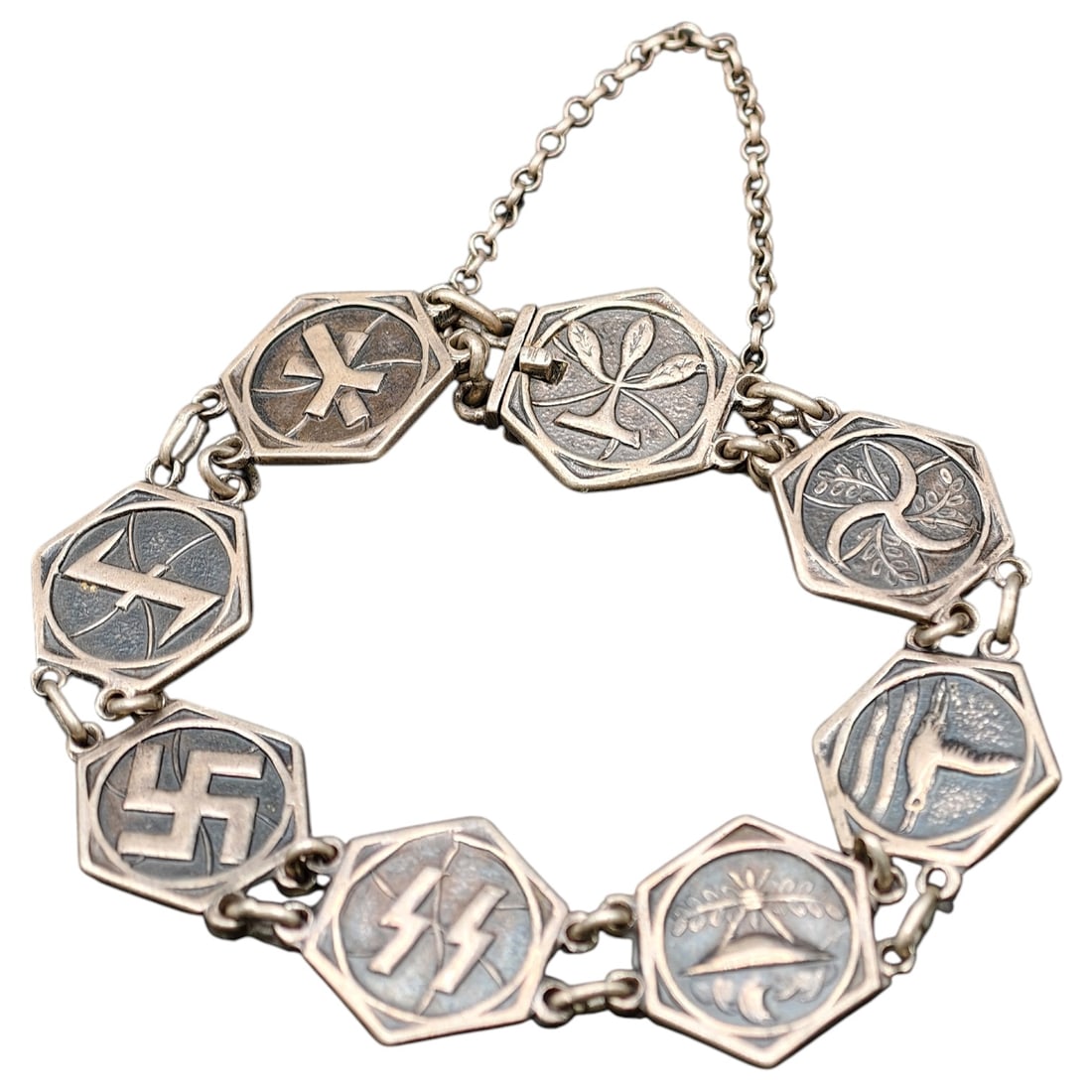 Third Reich Collaboration Dutch SS NSB Silver Bracelet: This very rare Dutch collaboration bracelet contains several symbols of various Dutch collaboration organizations such as the Dutch SS, Jeugdstorm, NSVO, Argrarisch Front, Wolfshook. The pin (offered 