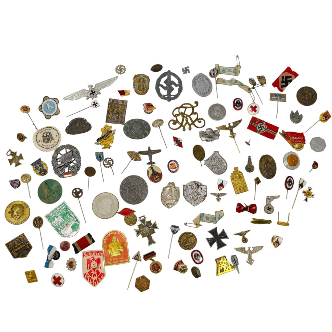 Mixed Lot of German WWII-era and Related Badges, Stickpins, and Tinnies (WHW, Sport, Red Cross, and: A large mixed lot of small badges, stickpins, tinnie donation badges, medals, and pin-back insignia, mostly German WWII/Third Reich period along with some Imperial German and post-war items. Materials
