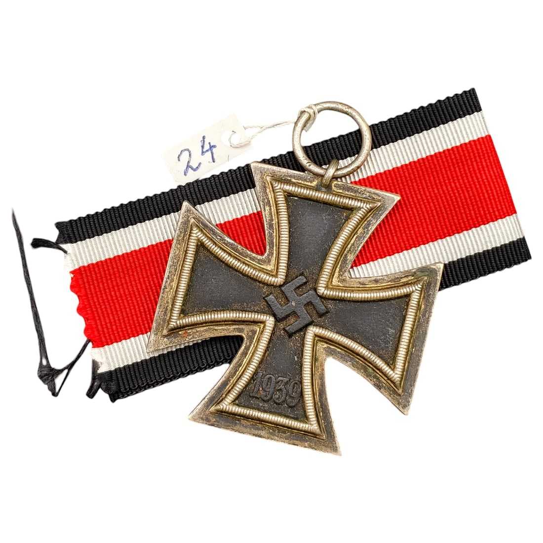 1939 Iron Cross 2nd Class: A World War II German Iron Cross Second Class (Eisernes Kreuz 2. Klasse), dated 1939, obverse featuring a mobile swastika at center and dated 1813 to reverse.