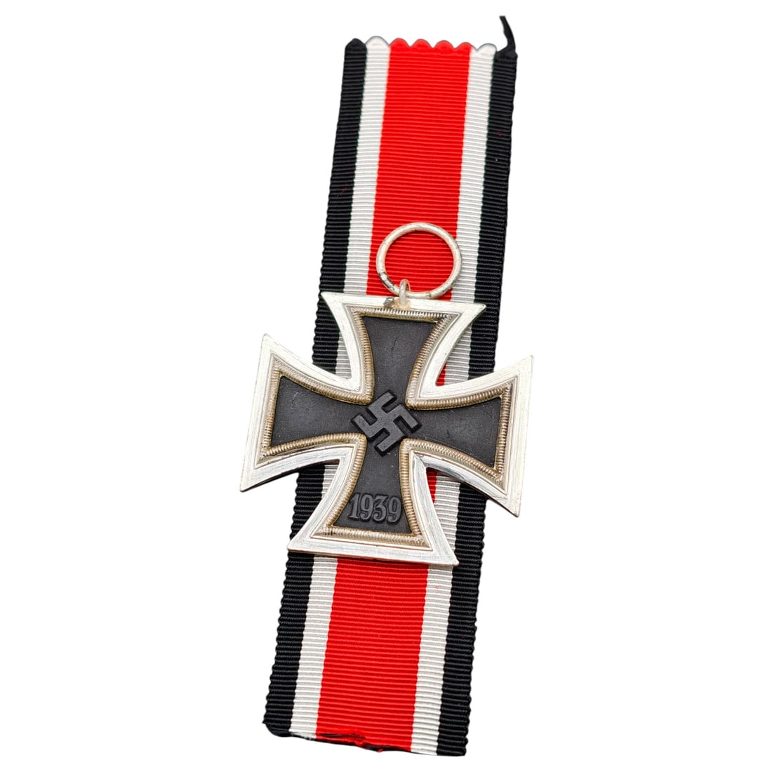 1939 Iron Cross 2nd Class: A World War II German Iron Cross Second Class (Eisernes Kreuz 2. Klasse), dated 1939, obverse featuring a mobile swastika at center and dated 1813 to reverse.