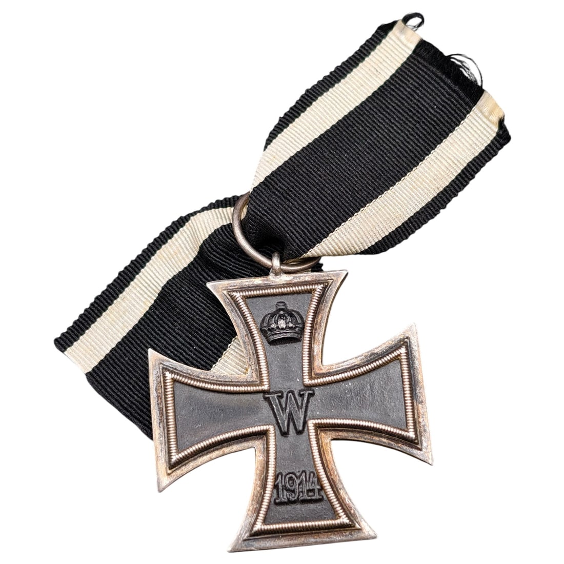 1914 Iron Cross 2nd Class: A WWI-era Iron Cross 2nd Class, dated 1914, with crowned 'W' cypher on the obverse and reverse showing 'FW' cypher, oak leaves, and '1813' commemorating the original 1813 founding of the order.The Iro