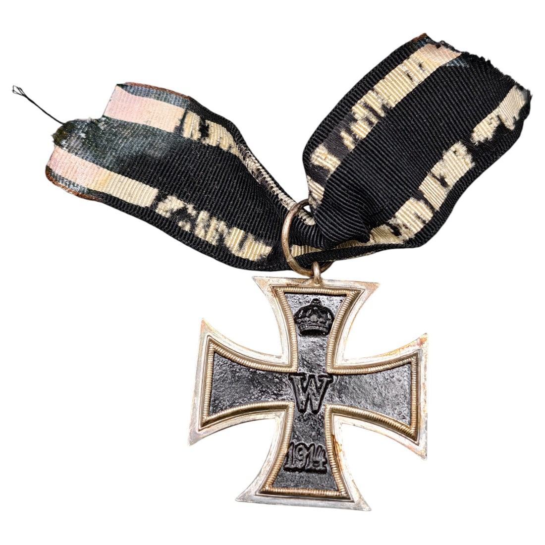 1914 Iron Cross 2nd Class: A WWI-era Iron Cross 2nd Class, dated 1914, with crowned 'W' cypher on the obverse and reverse showing 'FW' cypher, oak leaves, and '1813' commemorating the original 1813 founding of the order.The Iro