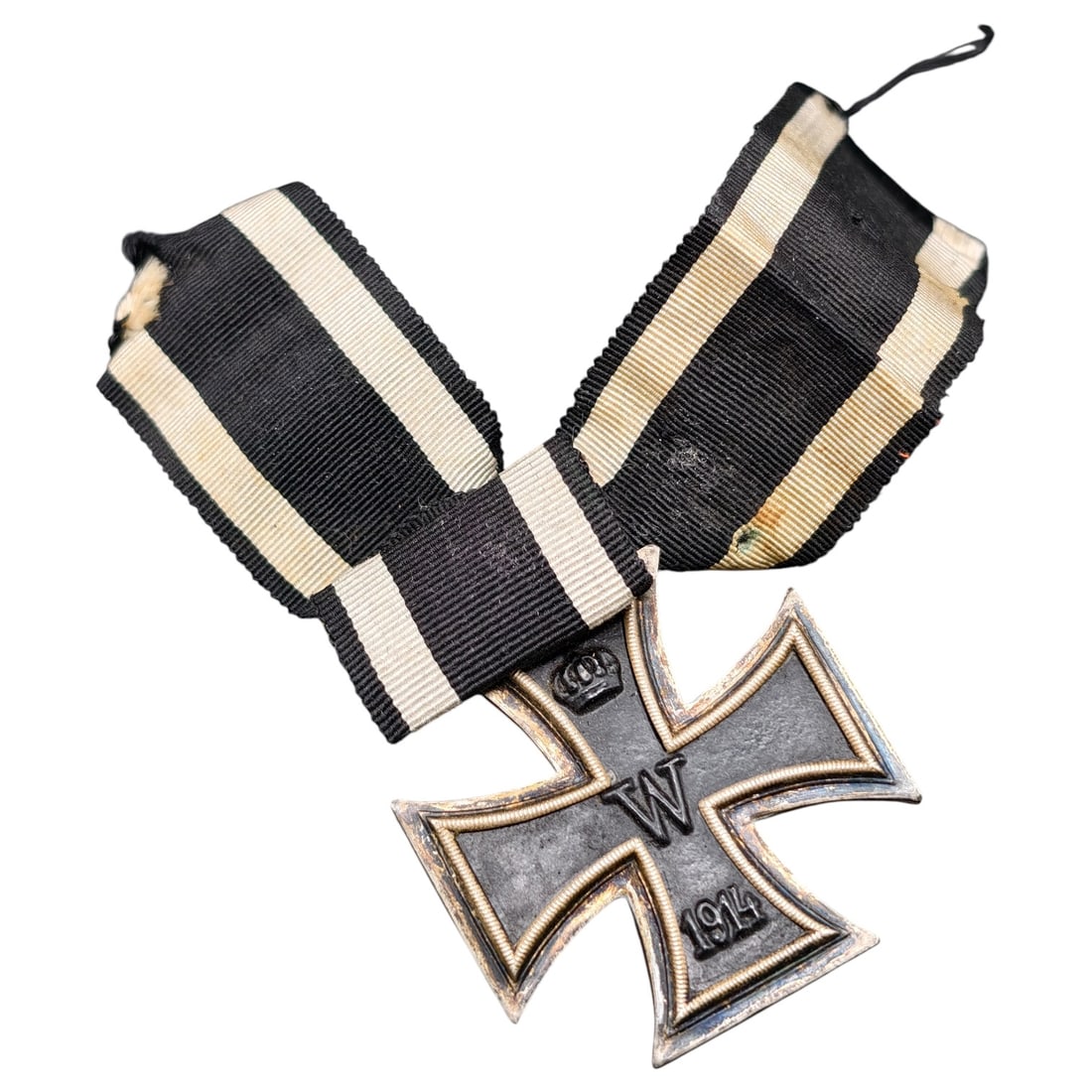 1914 Iron Cross 2nd Class: A WWI-era Iron Cross 2nd Class, dated 1914, with crowned 'W' cypher on the obverse and reverse showing 'FW' cypher, oak leaves, and '1813' commemorating the original 1813 founding of the order.The