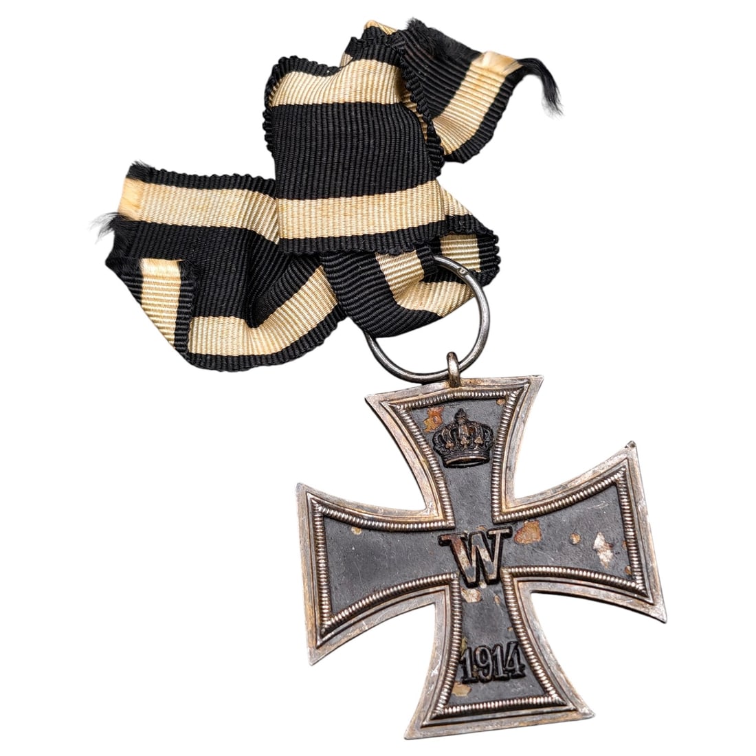 1914 Iron Cross 2nd Class: A WWI-era Iron Cross 2nd Class, dated 1914, with crowned 'W' cypher on the obverse and reverse showing 'FW' cypher, oak leaves, and '1813' commemorating the original 1813 founding of the order.The Iro