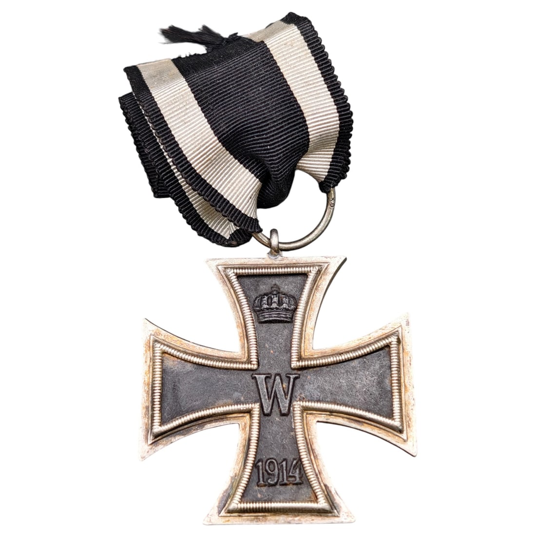 1914 Iron Cross 2nd Class: A WWI-era Iron Cross 2nd Class, dated 1914, with crowned 'W' cypher on the obverse and reverse showing 'FW' cypher, oak leaves, and '1813' commemorating the original 1813 founding of the order.The Iro