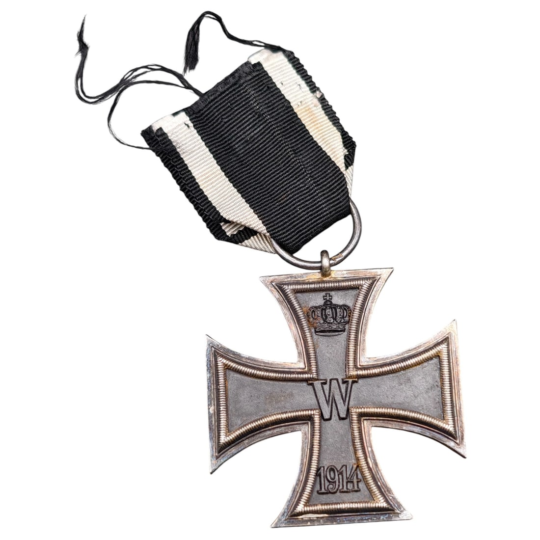 1914 Iron Cross 2nd Class: A WWI-era Iron Cross 2nd Class, dated 1914, with crowned 'W' cypher on the obverse and reverse showing 'FW' cypher, oak leaves, and '1813' commemorating the original 1813 founding of the order.The