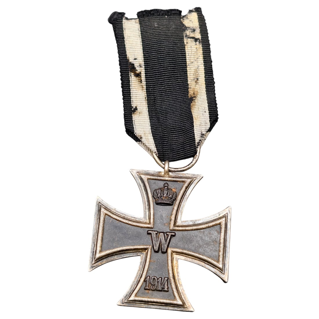 1914 Iron Cross 2nd Class: A WWI-era Iron Cross 2nd Class, dated 1914, with crowned 'W' cypher on the obverse and reverse showing 'FW' cypher, oak leaves, and '1813' commemorating the original 1813 founding of the order.The Iro
