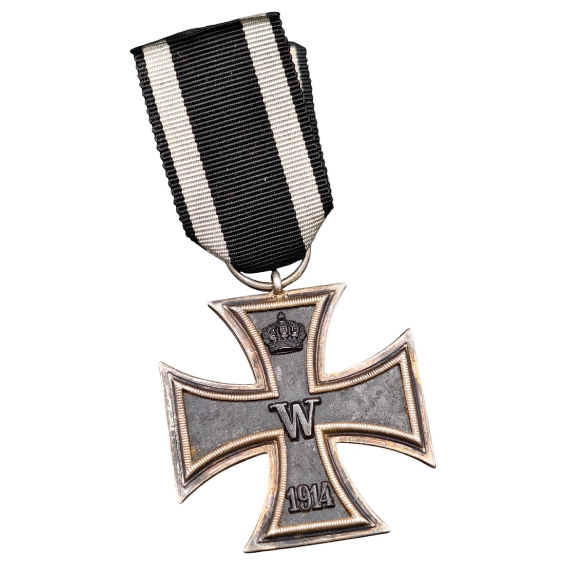 1914 Iron Cross 2nd Class: A WWI-era Iron Cross 2nd Class, dated 1914, with crowned 'W' cypher on the obverse and reverse showing 'FW' cypher, oak leaves, and '1813' commemorating the original 1813 founding of the order.The Iro