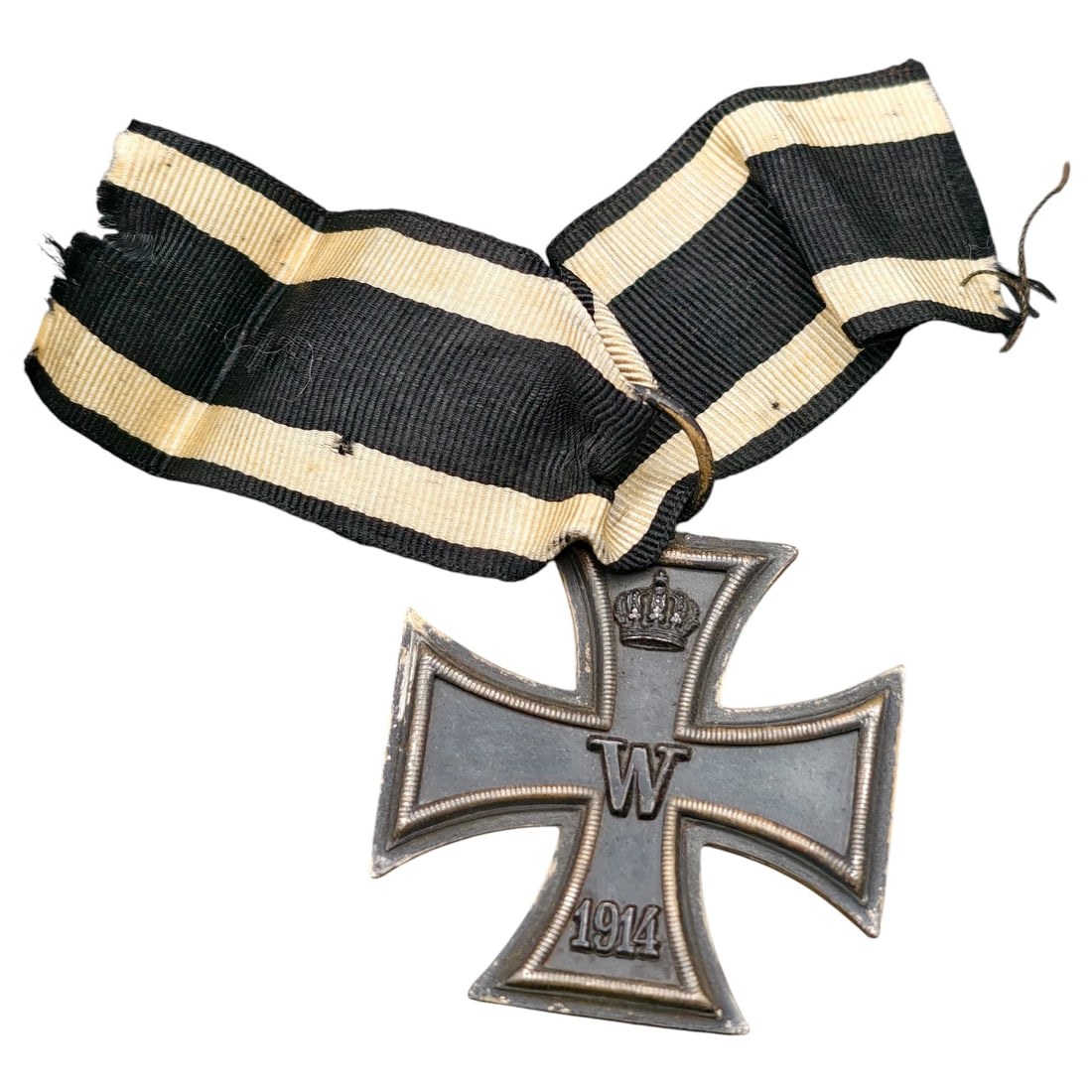1914 Iron Cross 2nd Class: A WWI-era Iron Cross 2nd Class, dated 1914, with crowned 'W' cypher on the obverse and reverse showing 'FW' cypher, oak leaves, and '1813' commemorating the original 1813 founding of the order.The Iro