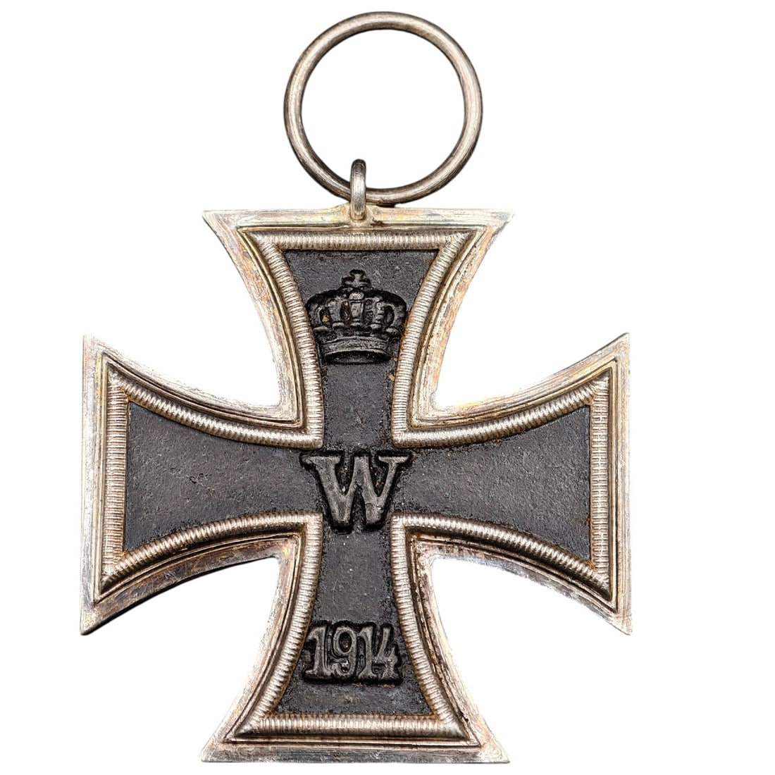1914 Iron Cross 2nd Class: A WWI-era Iron Cross 2nd Class, dated 1914, with crowned 'W' cypher on the obverse and reverse showing 'FW' cypher, oak leaves, and '1813' commemorating the original 1813 founding of the order.The Iro