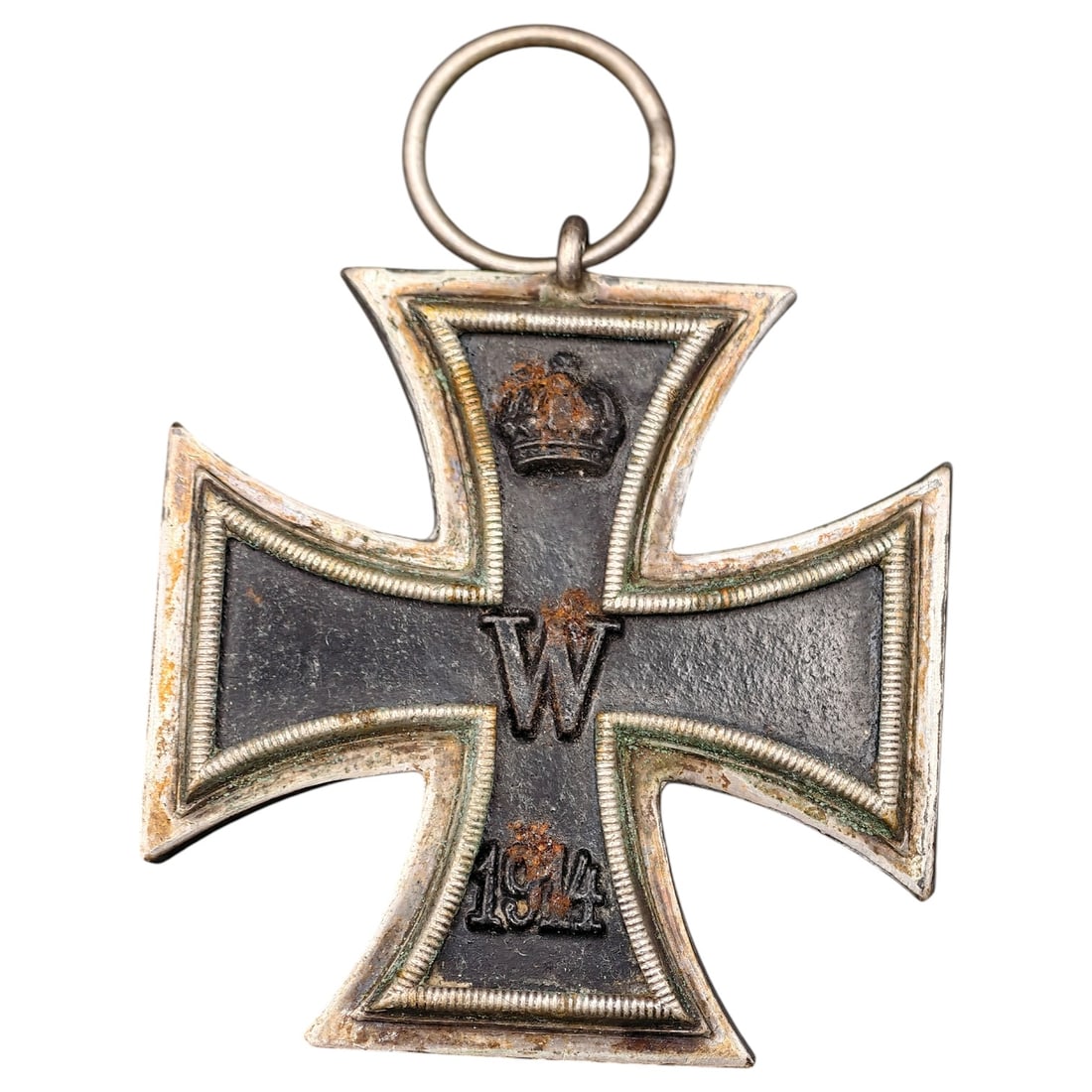 1914 Iron Cross 2nd Class: A WWI-era Iron Cross 2nd Class, dated 1914, with crowned 'W' cypher on the obverse and reverse showing 'FW' cypher, oak leaves, and '1813' commemorating the original 1813 founding of the order.The Iro