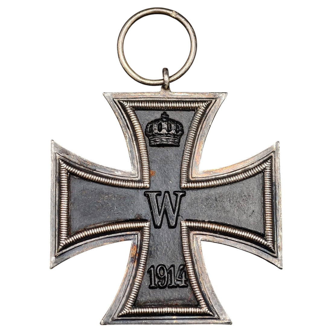 1914 Iron Cross 2nd Class: A WWI-era Iron Cross 2nd Class, dated 1914, with crowned 'W' cypher on the obverse and reverse showing 'FW' cypher, oak leaves, and '1813' commemorating the original 1813 founding of the order.The Iro