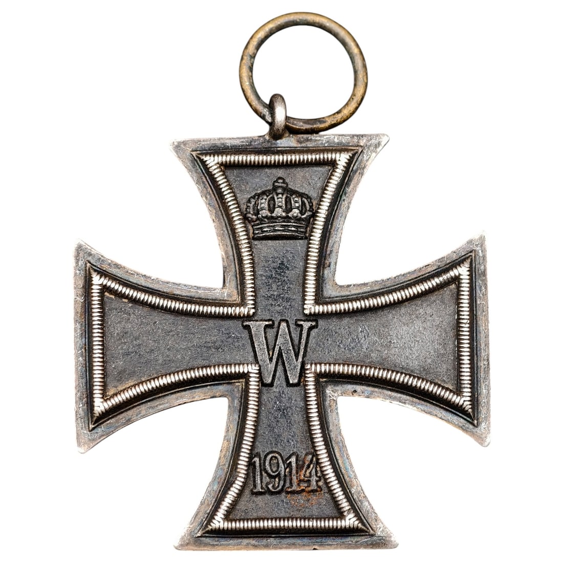 1914 Iron Cross 2nd Class: A WWI-era Iron Cross 2nd Class, dated 1914, with crowned 'W' cypher on the obverse and reverse showing 'FW' cypher, oak leaves, and '1813' commemorating the original 1813 founding of the order.The Iro