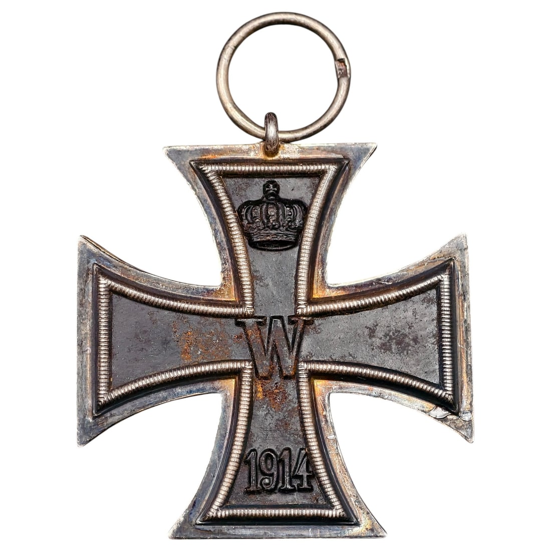 1914 Iron Cross 2nd Class: A WWI-era Iron Cross 2nd Class, dated 1914, with crowned 'W' cypher on the obverse and reverse showing 'FW' cypher, oak leaves, and '1813' commemorating the original 1813 founding of the order.The Iro