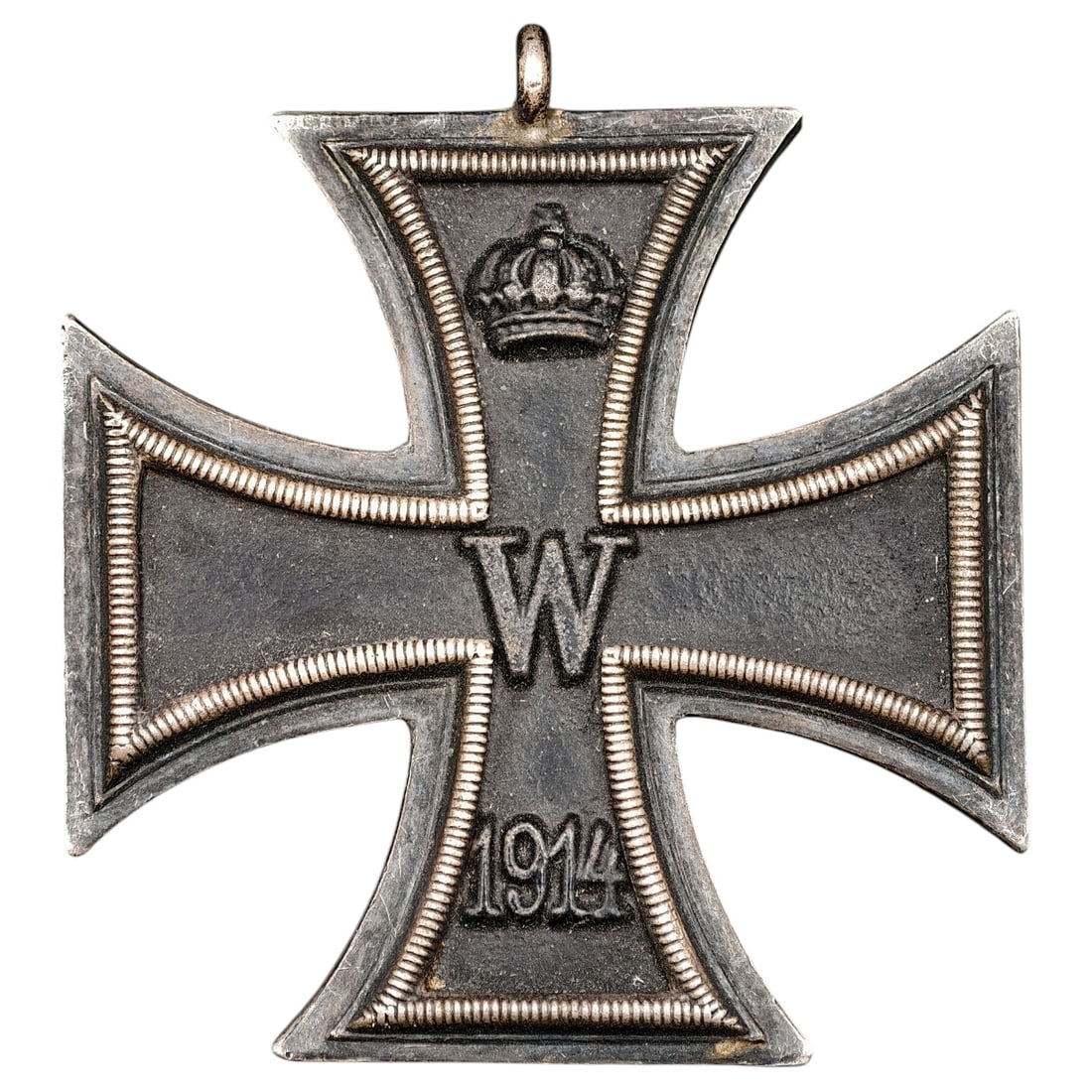 1914 Iron Cross 2nd Class: A WWI-era Iron Cross 2nd Class, dated 1914, with crowned 'W' cypher on the obverse and reverse showing 'FW' cypher, oak leaves, and '1813' commemorating the original 1813 founding of the order.The Iro
