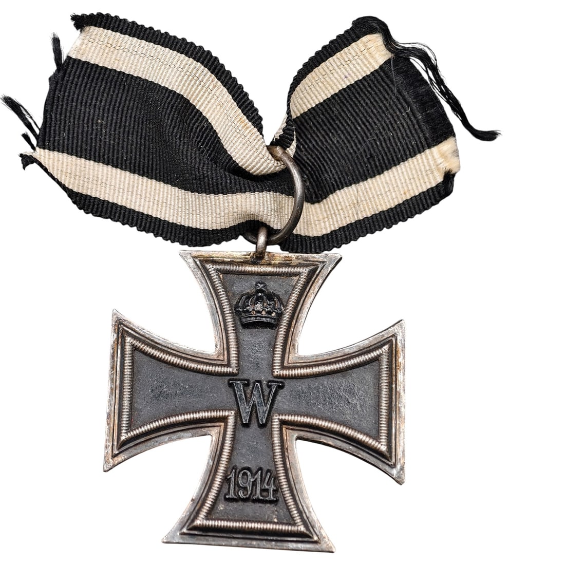 1914 Iron Cross 2nd Class: A WWI-era Iron Cross 2nd Class, dated 1914, with crowned 'W' cypher on the obverse and reverse showing 'FW' cypher, oak leaves, and '1813' commemorating the original 1813 founding of the order.The Iro