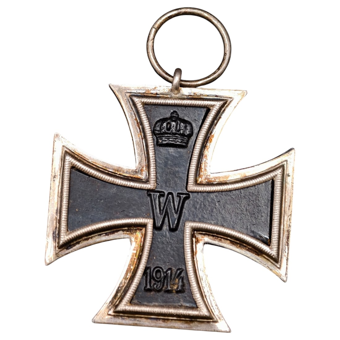 1914 Iron Cross 2nd Class: A WWI-era Iron Cross 2nd Class, dated 1914, with crowned 'W' cypher on the obverse and reverse showing 'FW' cypher, oak leaves, and '1813' commemorating the original 1813 founding of the order.The Iro