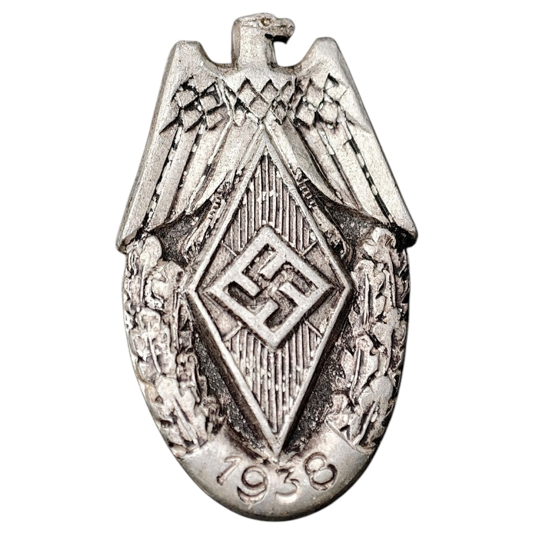 Third Reich Nazi Hitler Youth HJ 1938 Badge: A tinnie-style membership/event badge featuring a stylized eagle atop a diamond-shaped HJ emblem, dated 1938 within the lower field. The reverse bears the maker mark "ESCHL" impressed near the reverse