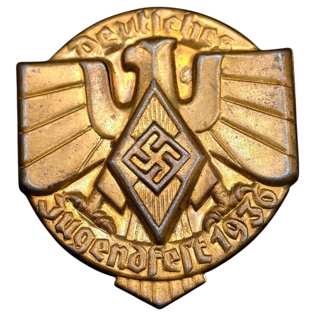 Third Reich Nazi Hitler Youth 1936 Tinnie: A commemorative tinnie in what appears to be gilt-metal for the 1936 'Deutsches Jugendfest' (German Youth Festival), featuring a stylized eagle with outstretched wings above a Hitler Youth diamond emb