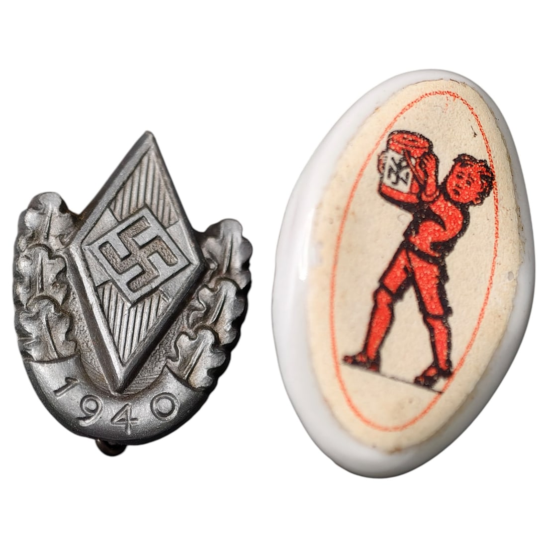 German WWII HJ-Style 1940 Diamond Pin and WHW-Style Donation Badge (2 pieces): A two-piece lot comprising a diamond-shaped Hitler Youth (HJ) membership badge dated 1940, with stamped swastika device flanked by oak leaves, and a small oval donation tinnie (WHW type) with a printe