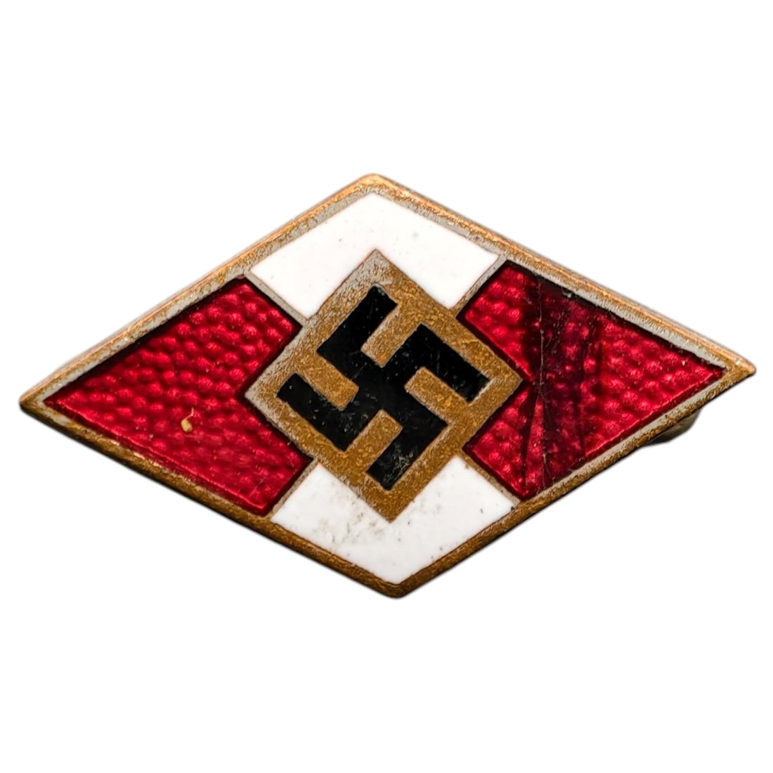 Hitler Youth Membership Badge: Diamond-shaped membership badge with red and white enamel sections surrounding a central swastika on a field appearing to be silver-toned.
