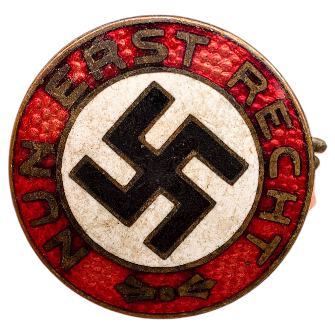 Early NSDAP Slogan Badge Nun Erst Recht: A round enameled membership/slogan badge featuring a black mobile swastika on white ground, encircled by a red enamel band with raised gothic-style lettering reading 'NUN ERST RECHT' (Now More Than