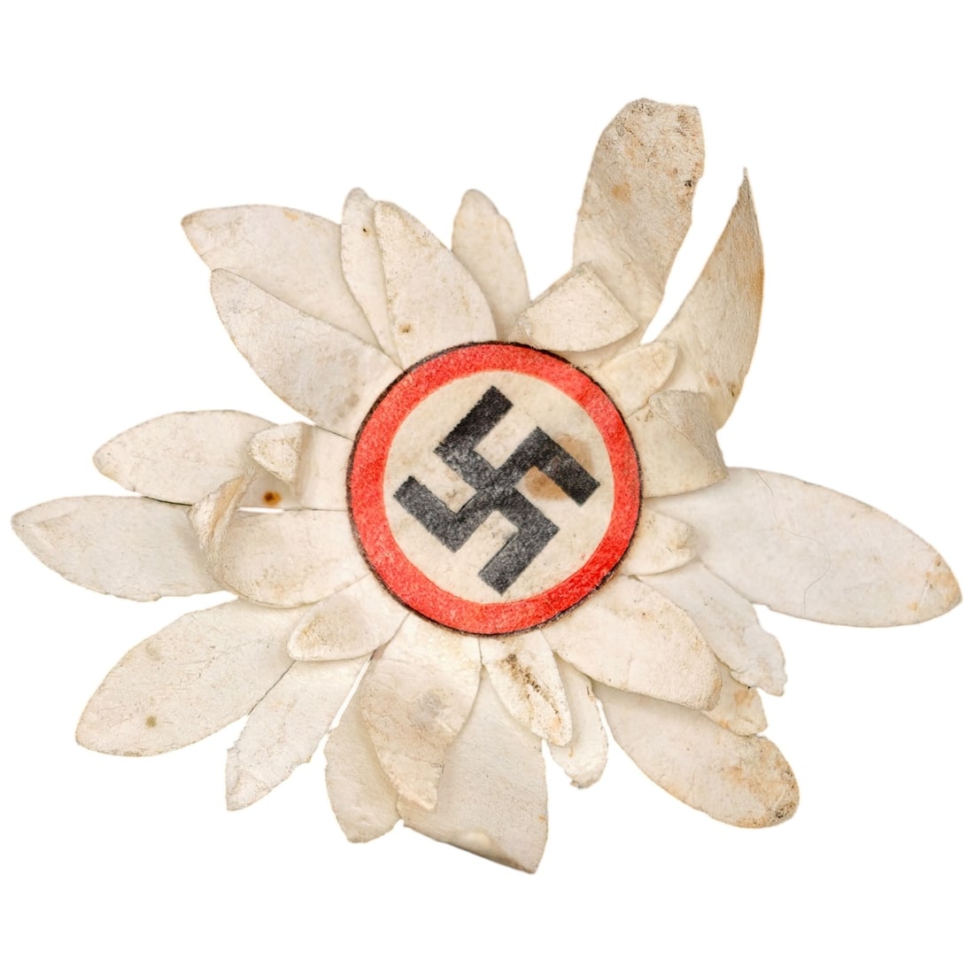 Early NSDAP Paper Flower Pin Badge: A fabric/paper petal flower badge (edelweiss-form) with a central celluloid or paper disc bearing a red field and black swastika. The petals are constructed of layered white cloth-backed paper. This
