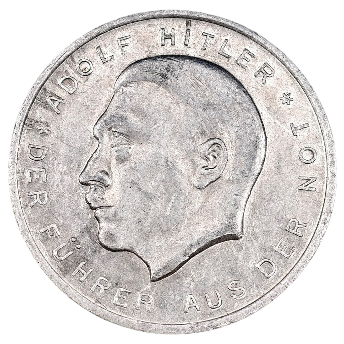 Adolf Hitler 1930 Election Token: Aluminum election propaganda token issued for the 14 September 1930 Reichstag election. Obverse depicts a left-facing profile bust of Adolf Hitler with the legend 'ADOLF HITLER * DER FÜHRER AUS DER N