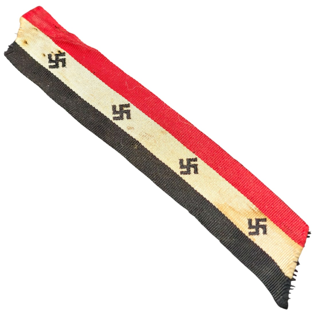 Early NSDAP Ribbon: A length of woven ribbon in the German national colors of black, white, and red, decorated with repeating small woven swastika emblems along the white stripe. The ribbon appears to be cut fabric,