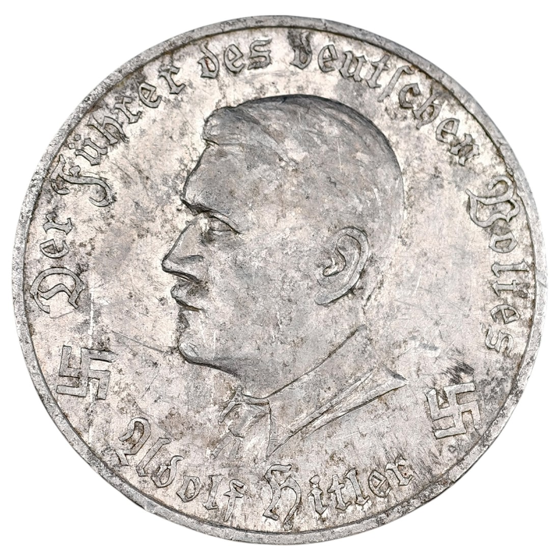 Austrian NSDAP 'Gau Karnten' Hitler Donation Jeton (Schilling Kampfspende): Aluminum donation token ("Jeton") issued by the then-illegal NSDAP in Austria for the Gau Kärnten (Carinthia) region, circa 1933–1938. Obverse depicts a left-facing portrait of Adolf Hitler with th