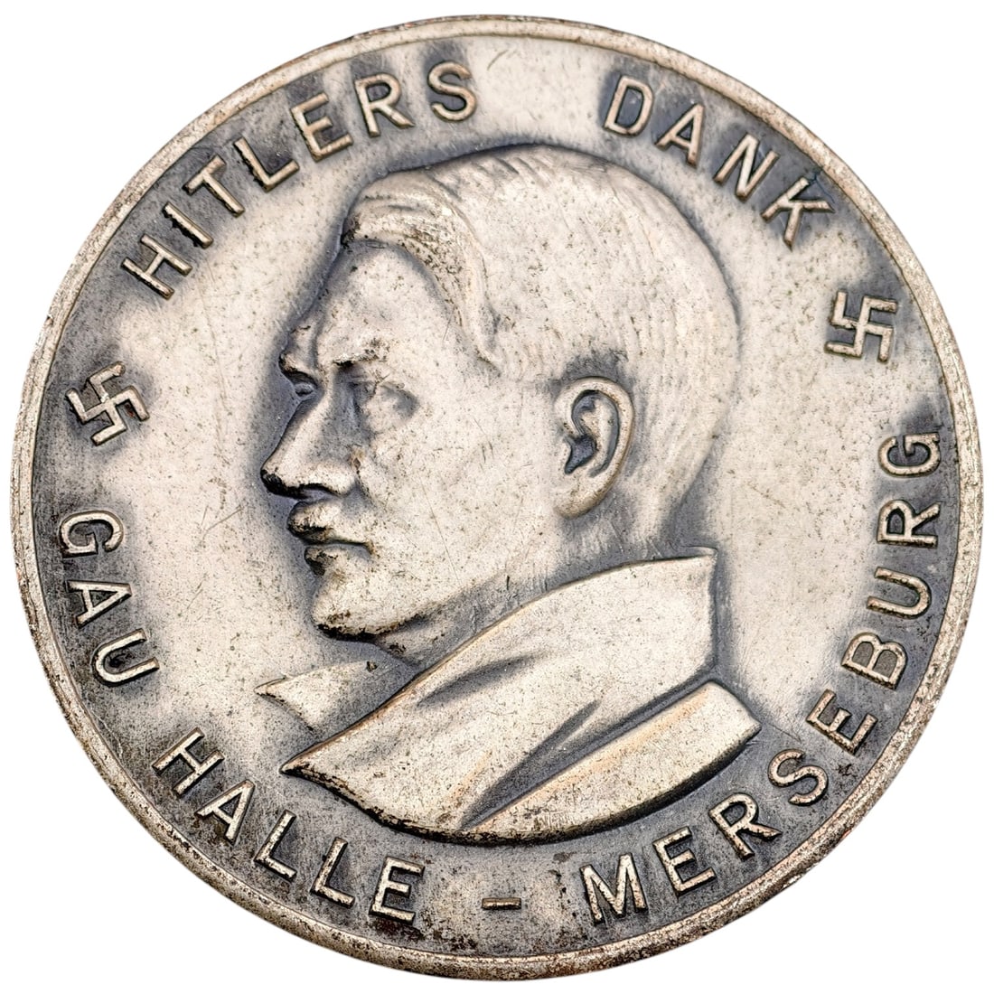 Adolf Hitler Gau Halle Medallion 1933: A Third Reich period commemorative medallion issued for the Winterhilfswerk des Deutschen Volkes (Winter Relief of the German People), 1933/34 campaign. Obverse depicts a left-facing profile portrait