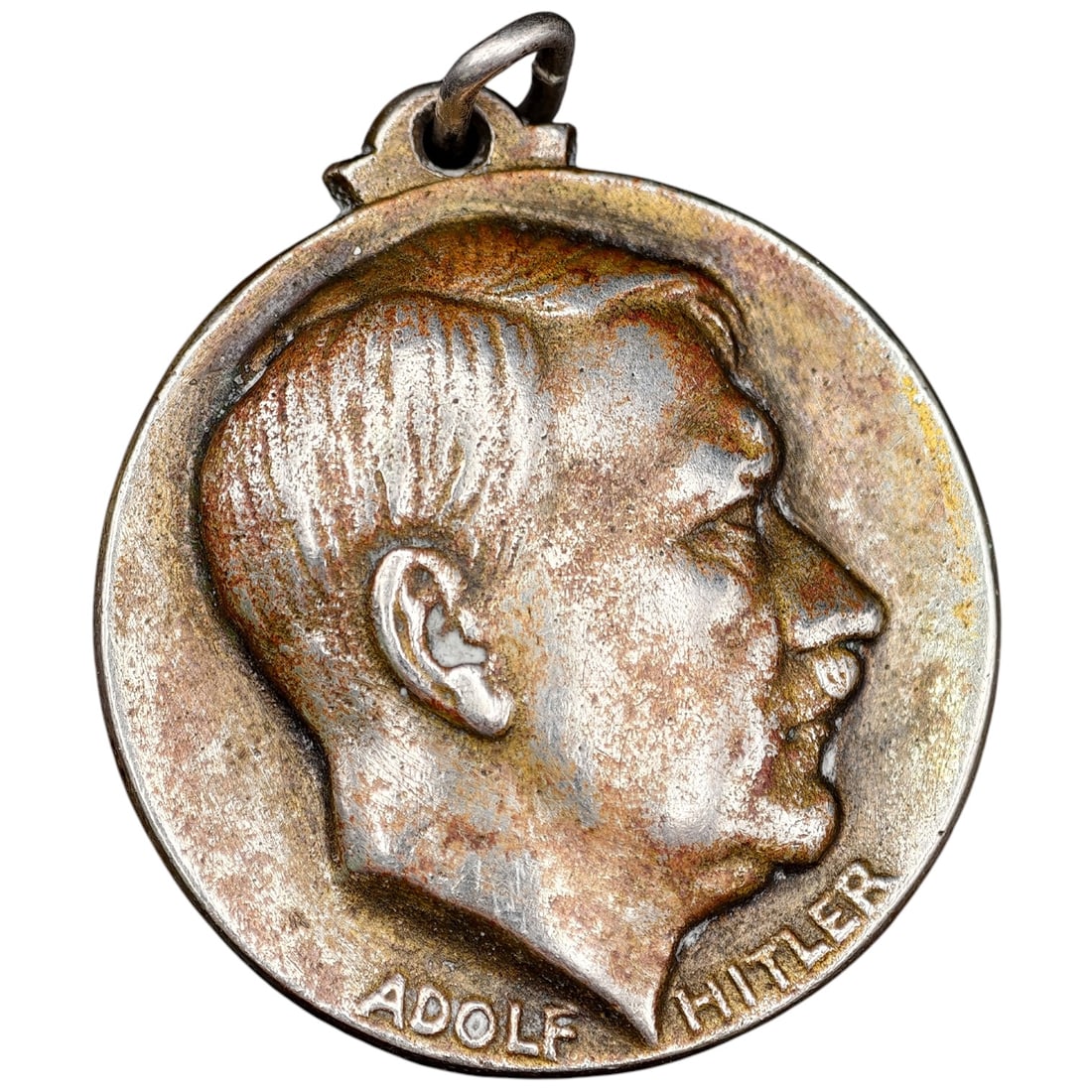 Early NSDAP Adolf Hitler Medallion: A commemorative pendant medal featuring a left-facing profile portrait of Adolf Hitler on the obverse with his name in raised letters below. The reverse depicts a swastika emblem rising above clouds w