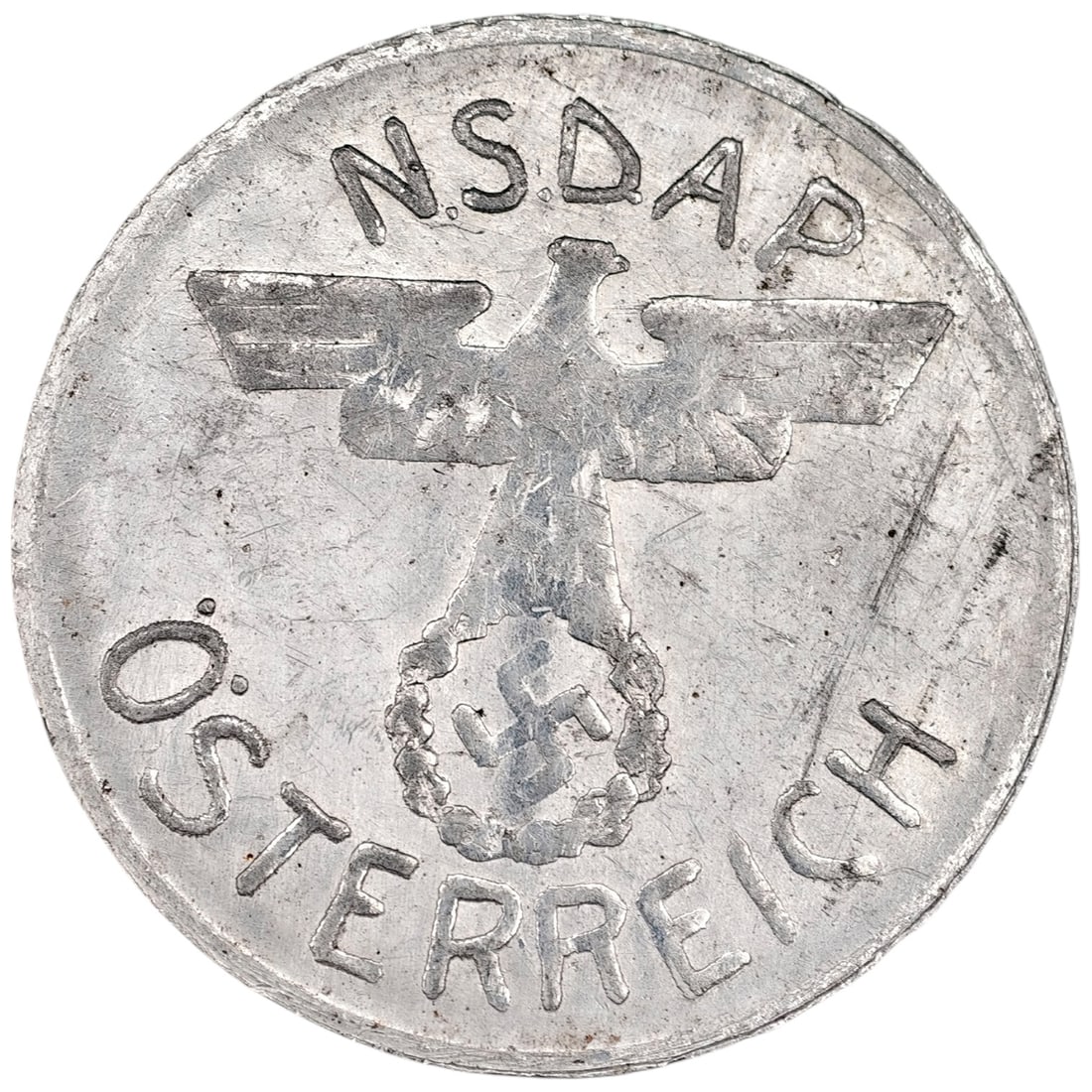 NSDAP Osterreich Token: An aluminum donation token/coin marked N.S.D.A.P. ÖSTERREICH with a Parteiadler (party eagle) above a wreathed swastika on the obverse, and KAMPFSPENDE SCHILLING with wheat sheaf motif on the