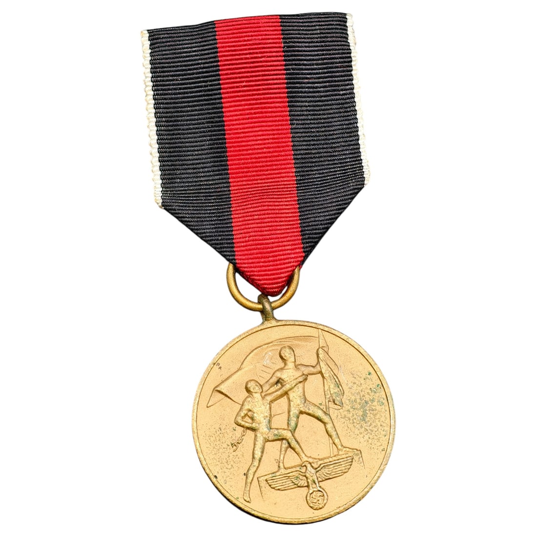 Third Reich Nazi Sudetenland Medal: Third Reich commemorative medal issued to mark the annexation of the Sudetenland, featuring two male figures with flags standing over an eagle and swastika on the obverse. The reverse bears the inscri