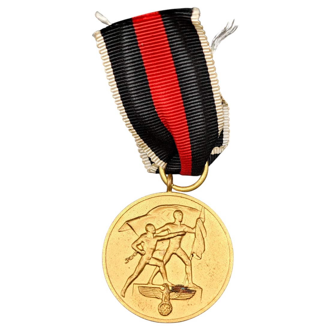 Third Reich Nazi Sudetenland Medal: Third Reich commemorative medal issued to mark the annexation of the Sudetenland, featuring two male figures with flags standing over an eagle and swastika on the obverse. The reverse bears the inscri