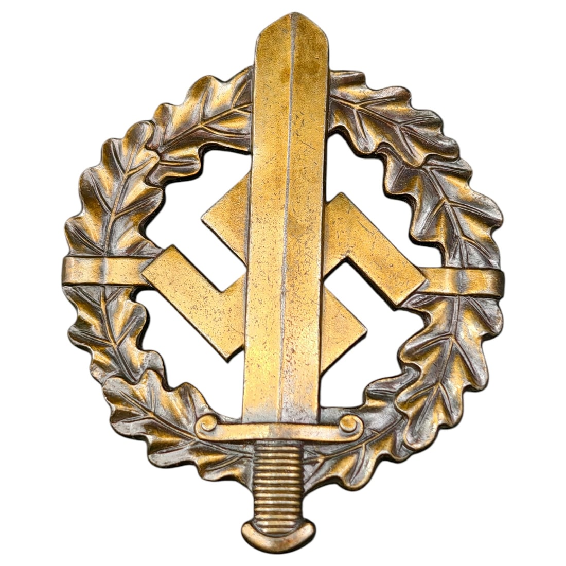 SA Sport Badge in Bronze – Third Reich Nazi Era Badge: A SA-Sportabzeichen (SA Sports Badge) in what appears to be bronze grade, featuring an oak leaf wreath surrounding a mobile swastika overlaid with a sword. The reverse is maker-marked "W. REDO SAARLAU