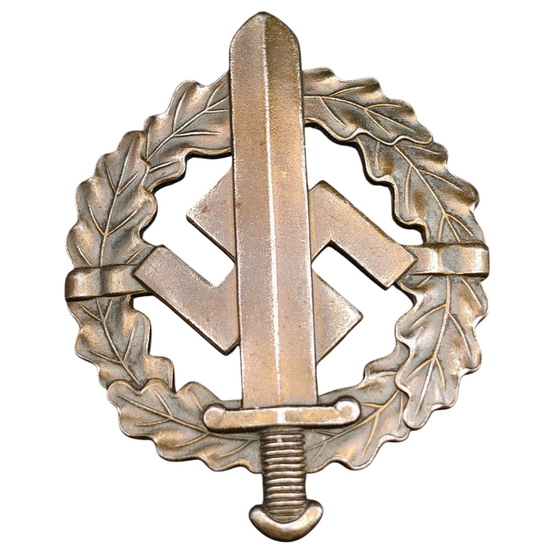 SA Sport Badge in Bronze – Third Reich Nazi Era Badge: A SA-Sportabzeichen (SA Sports Badge) in what appears to be bronze grade, featuring an oak leaf wreath surrounding a mobile swastika overlaid with a sword. The reverse is maker-marked "W. REDO SAARLAU