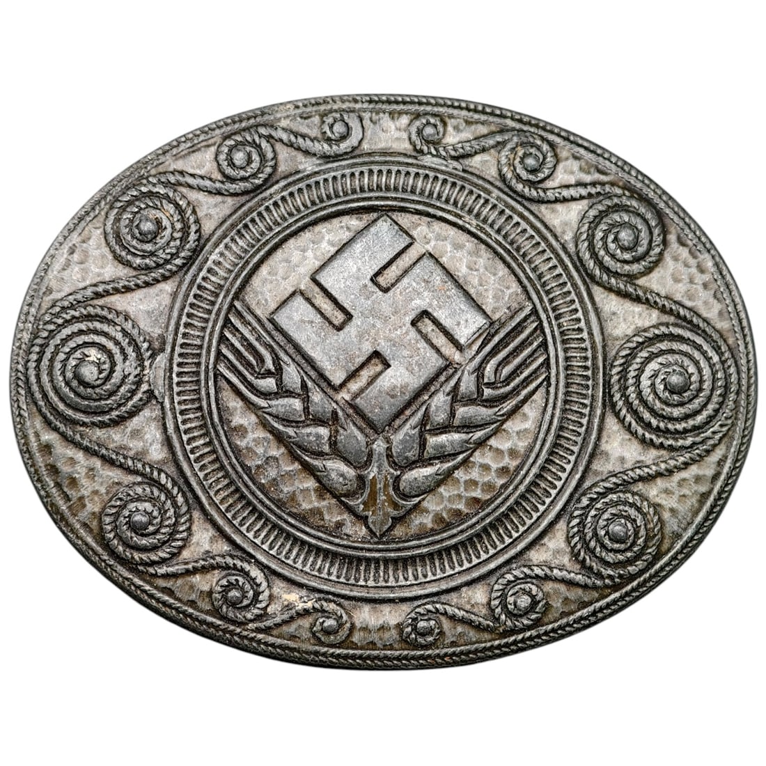 Third Reich Nazi RADwJ Brooch: Oval pin-back brooch featuring a swastika over crossed wheat sheaves, surrounded by a rope-and-scroll decorative border, likely associated with the Reichsarbeitsdienst der weiblichen Jugend (RADwJ).