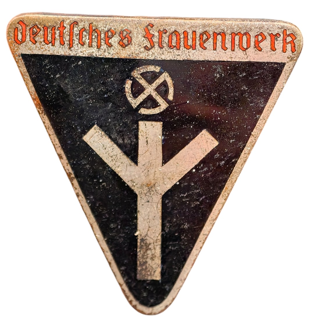 German WWII NS Frauenschaft Badge: Triangular membership badge for the NS-Frauenschaft (National Socialist Women's League), with red painted lettering reading 'NS-Frauenschaft' over a black enameled field bearing a stylized mobile swas