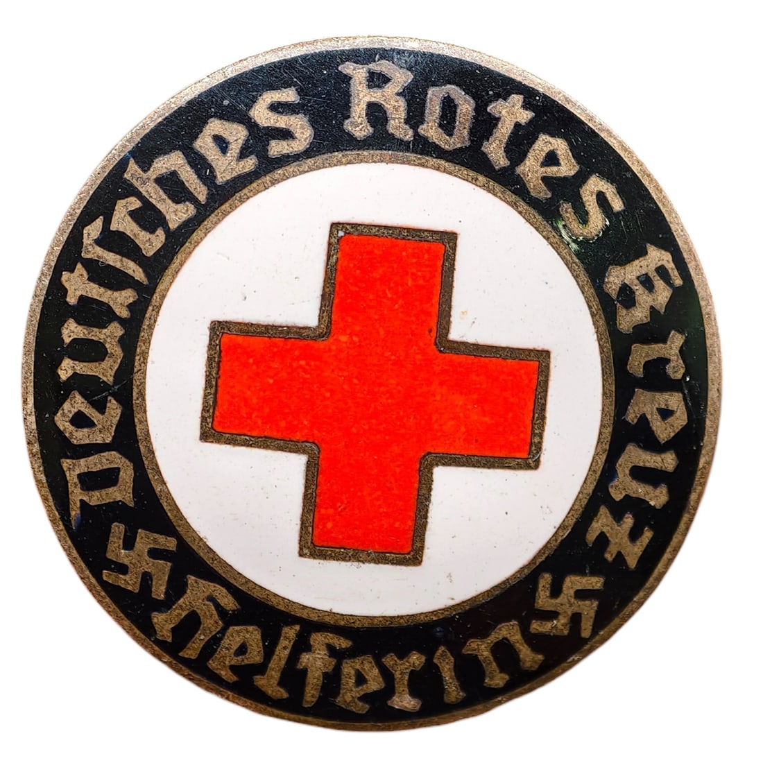 Third Reich Nazi Red Cross Badge: Enameled member badge for the Deutsches Rotes Kreuz (German Red Cross), inscribed "DEUTSCHES ROTES KREUZ HELFERIN" around a central red cross on white enamel field with black outer ring and gothic let